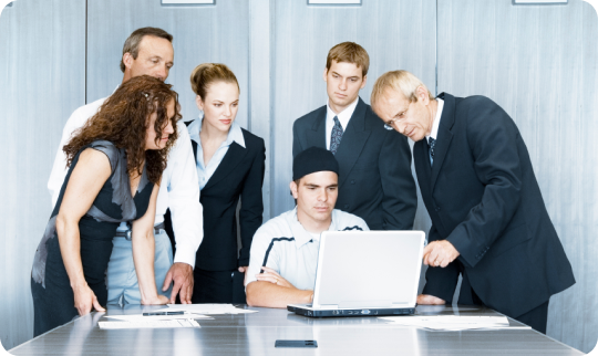 A group of corporate employees posing for a photograph